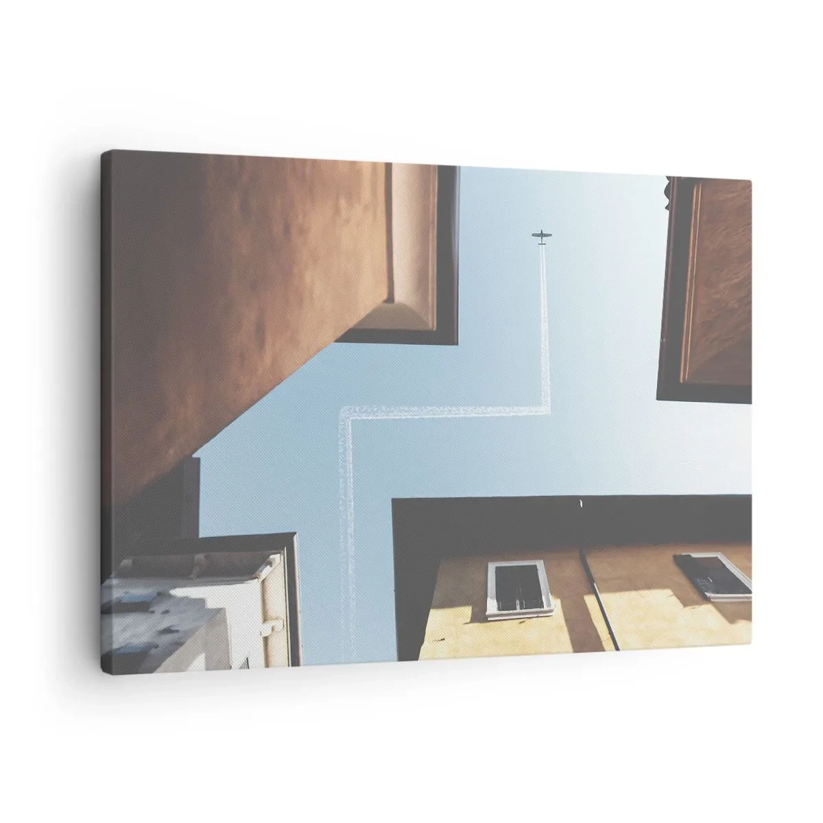 Lærredstryk - Billede på lærred - Udsigt over flyet og dets spor på himlen fra et gadeperspektiv - 70x50cm - Over den urbane labyrint - Moderne vægdekoration til stue og soveværelse ARTTOR