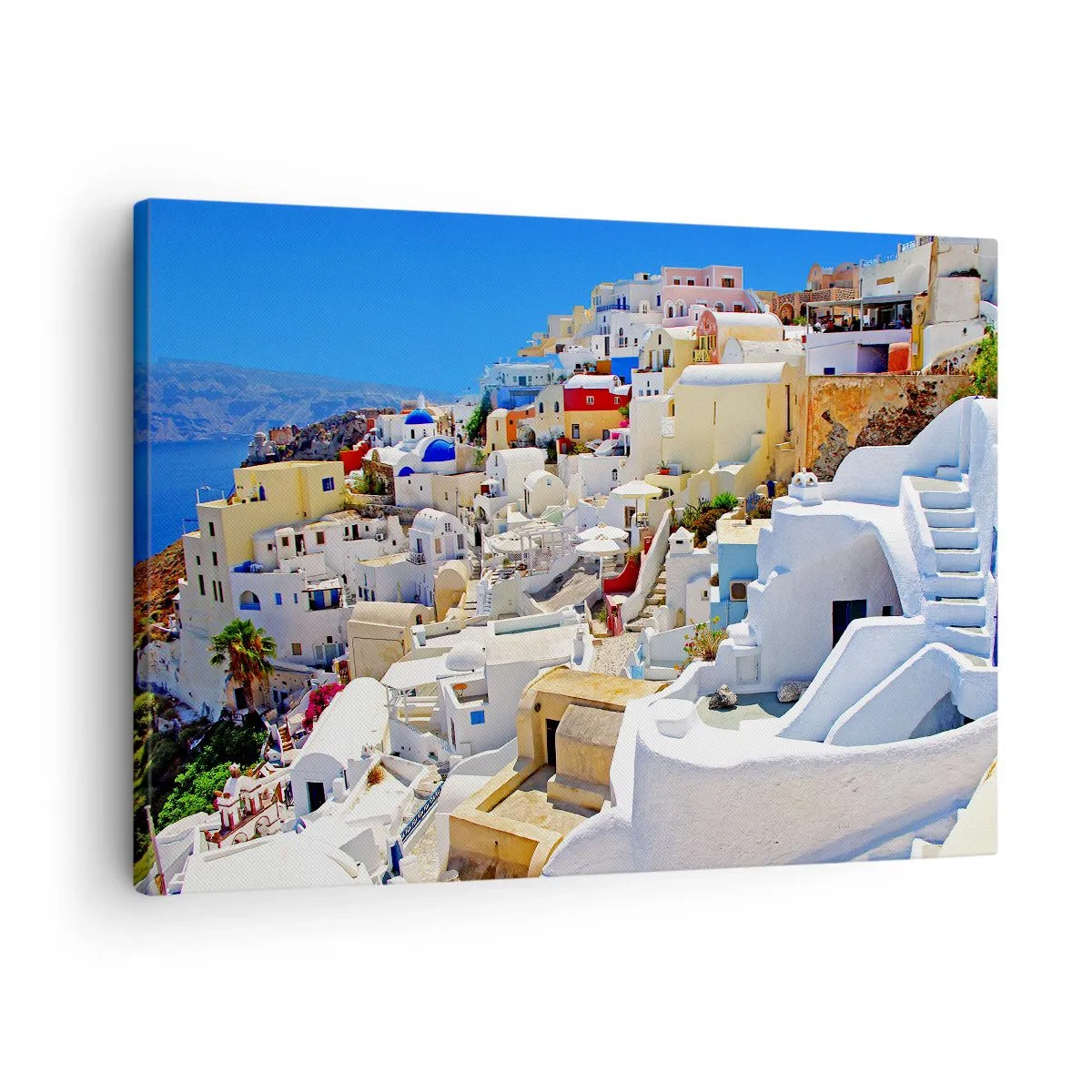 Lærredstryk - Billede på lærred - Panorama over Santorini med hvide huse og blå himmel - 70x50cm - Drømme om en græsk sommer - Moderne vægdekoration til stue og soveværelse ARTTOR