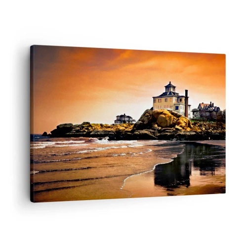 Lærredstryk - Billede på lærred - Et hus på en klippe ved stranden ved solnedgang med dets spejling i vandet - 70x50cm - Vestkystens elegance - Moderne vægdekoration til stue og soveværelse ARTTOR