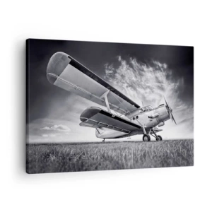 Lærredstryk - Billede på lærred - Et fly mod en dramatisk himmel i sort-hvid - 70x50cm - Den bevingede vandringsmand - Moderne vægdekoration til stue og soveværelse ARTTOR