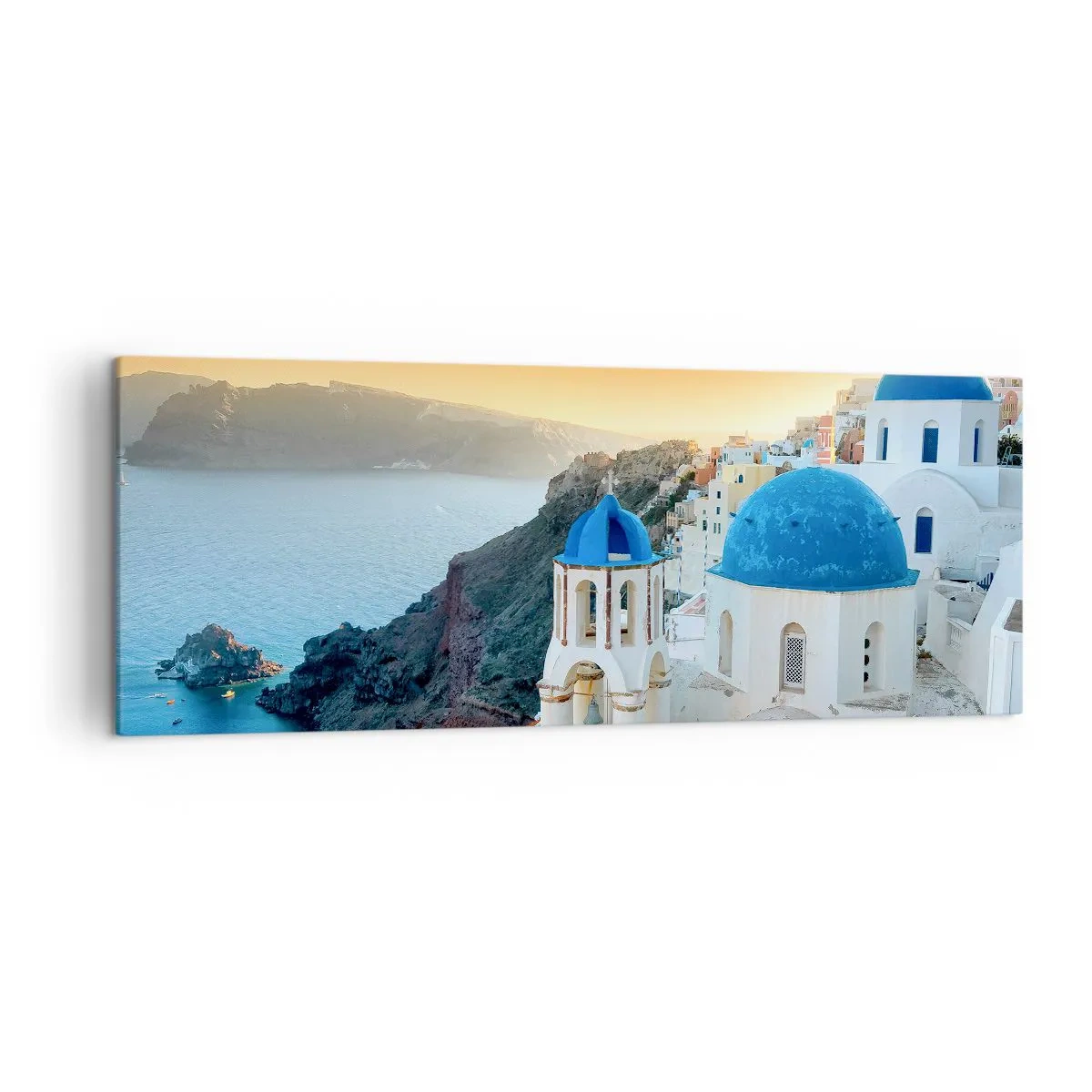 Lærredstryk - Billede på lærred - Santorini - omfavnet af klipperne - 140x50 cm