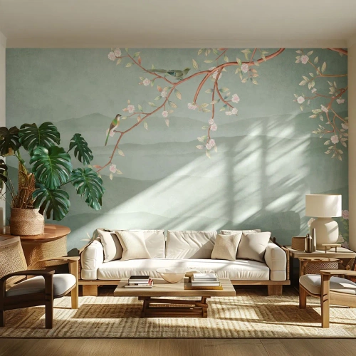 Fototapet Standard Eco - En blomstrende gren med fugle mod en baggrund af grønne bakker - 100x70cm - Forår, ah, det er dig - Moderne vægdekoration til stue og soveværelse ARTTOR