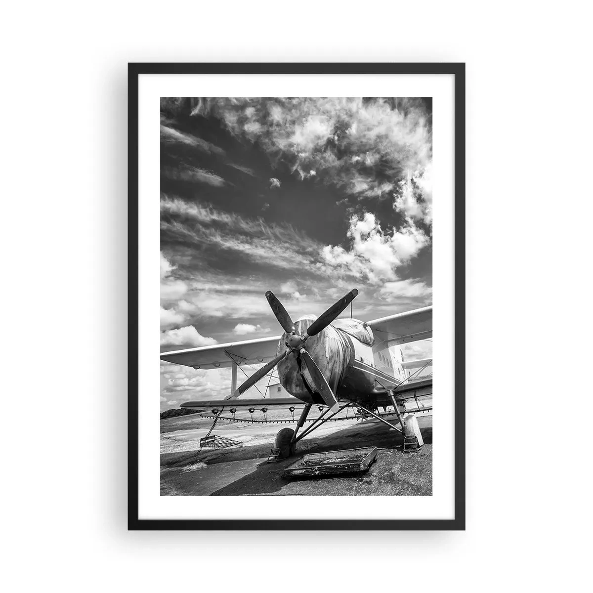 Plakat i sort ramme - Sort-hvidt foto af et retrofly mod himlen - 50x70cm - Jeg kan ikke vente! - Moderne vægdekoration til stue og soveværelse ARTTOR