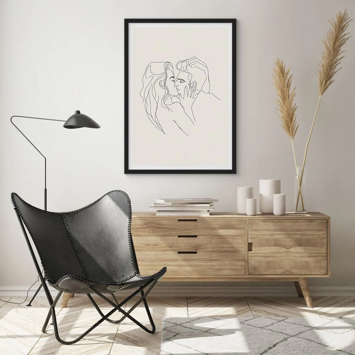 Plakat i sort ramme - En minimalistisk tegning af et forelsket par i fine linjer. - 50x70cm - Forviklet i følelser - Moderne vægdekoration til stue og soveværelse ARTTOR
