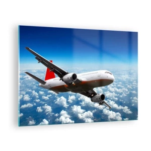 Billede på glas - Et passagerfly, der flyver over skyerne mod en blå himmel - 70x50cm - Kom væk fra det hele - Moderne vægdekoration til stue og soveværelse ARTTOR