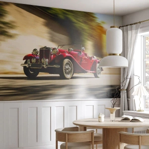 Fototapet Standard Eco - En rød klassisk cabriolet i dynamisk bevægelse - 100x70cm - Smukkere end Nike fra Samothrake - Moderne vægdekoration til stue og soveværelse ARTTOR