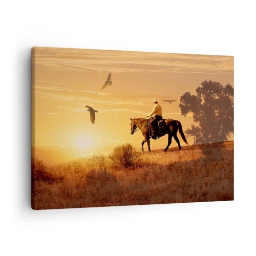 Lærredstryk - Billede på lærred - En rytter på en hest ved solnedgang mod prærien - 70x50cm - Alene på tværs af prærien - Moderne vægdekoration til stue og soveværelse ARTTOR
