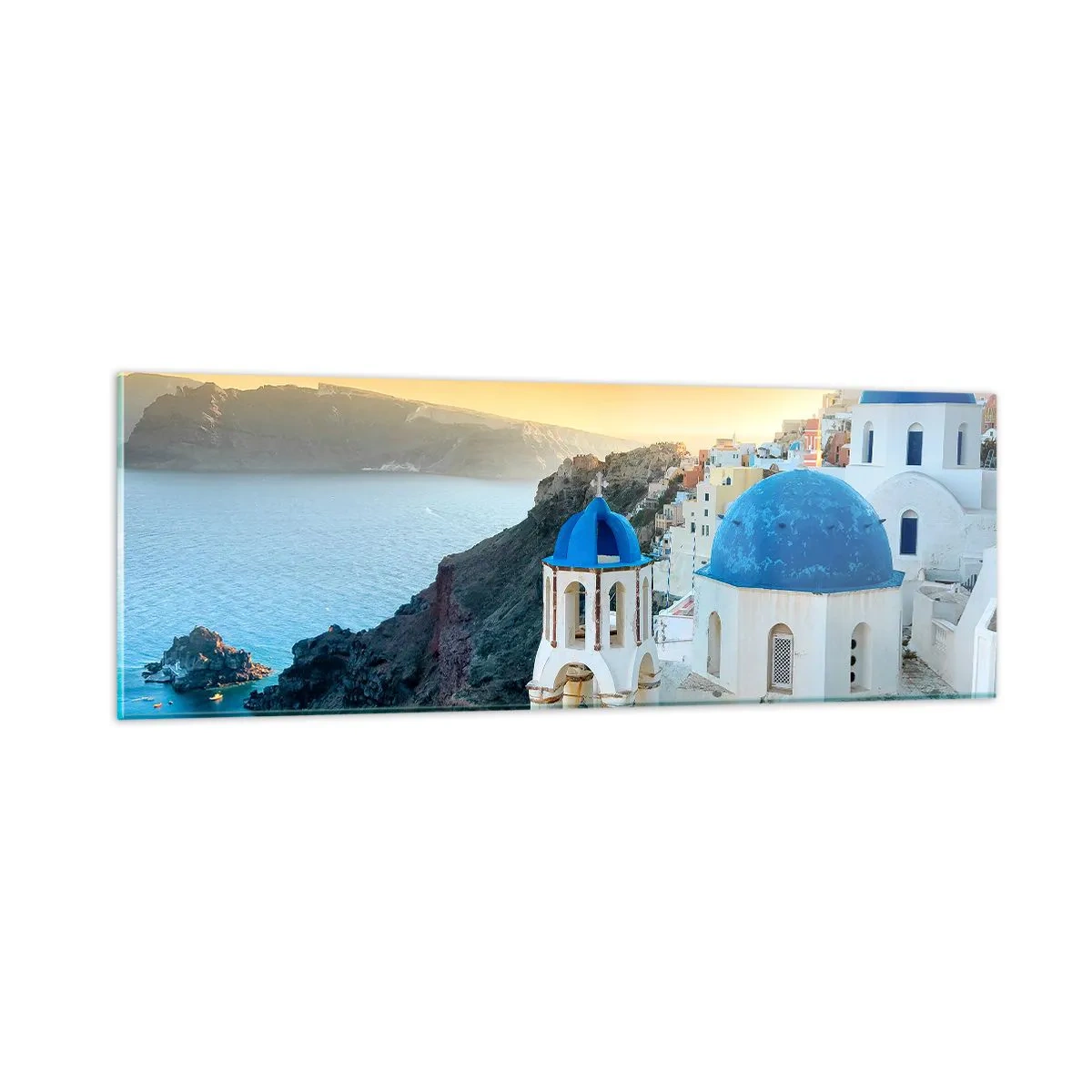 Billede på glas - Santorini - omfavnet af klipperne - 90x30 cm