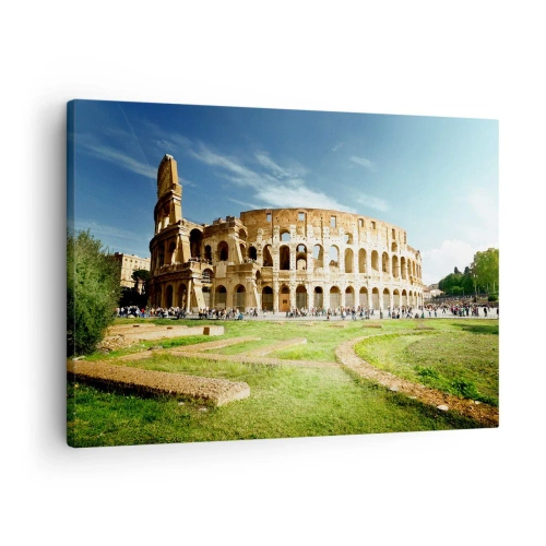 Lærredstryk - Billede på lærred - Colosseum i Rom omgivet af grønne områder og blå himmel - 70x50cm - Du kan stadig høre våbenklirren - Moderne vægdekoration til stue og soveværelse ARTTOR