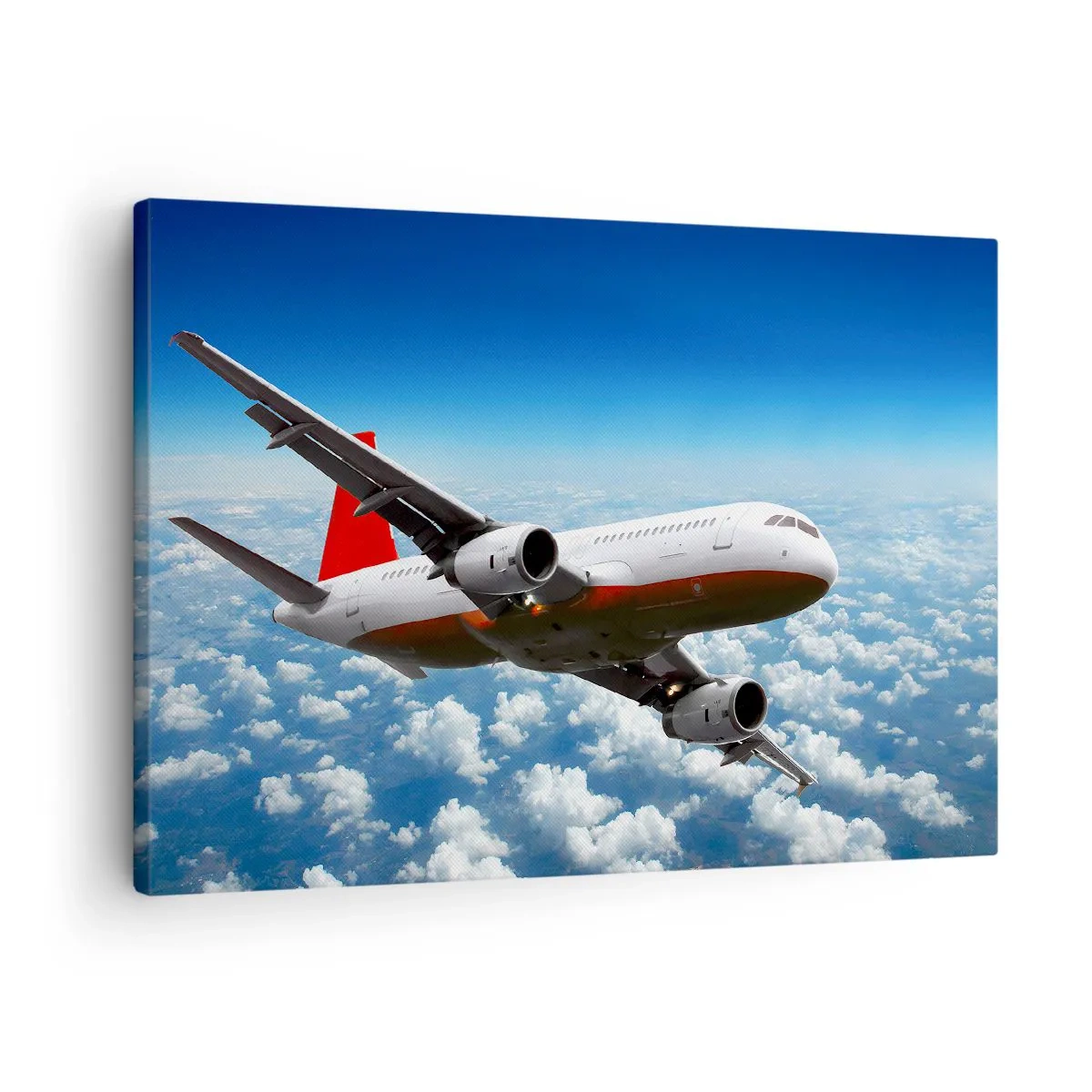 Lærredstryk - Billede på lærred - Et passagerfly, der flyver over skyerne mod en blå himmel. - 70x50cm - Kom væk fra det hele - Moderne vægdekoration til stue og soveværelse ARTTOR