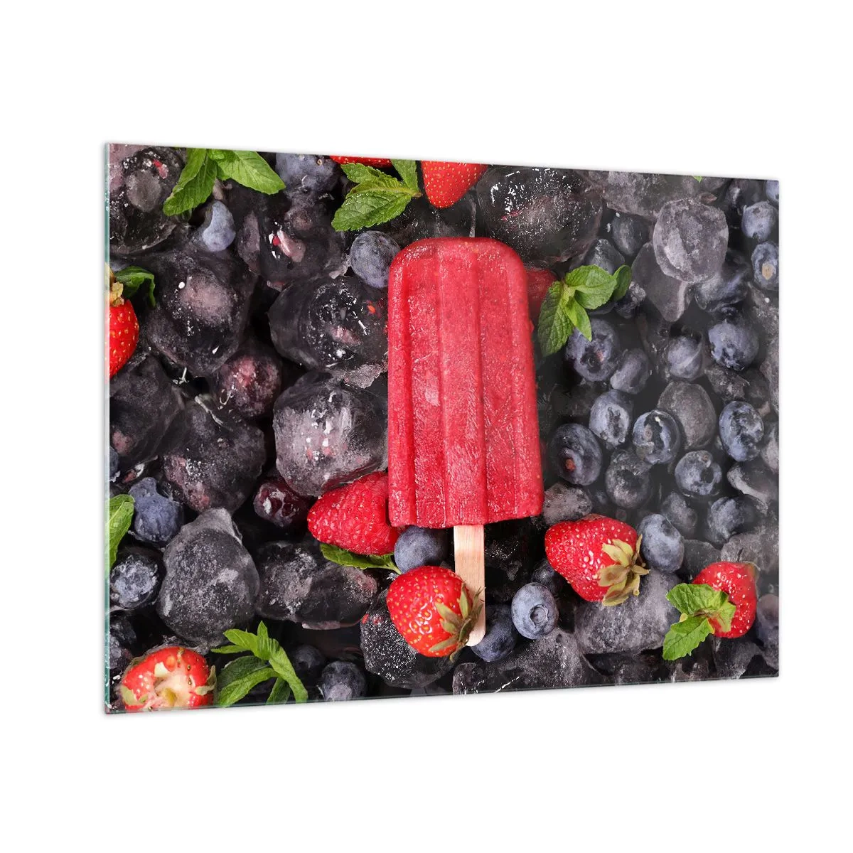 Billede på glas - En ispind blandt frossen frugt og mynteblade - 70x50cm - En smag af varm sommer - Moderne vægdekoration til stue og soveværelse ARTTOR